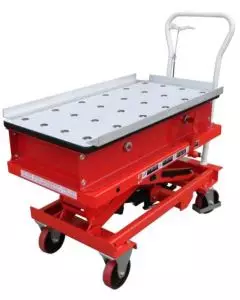 Red mobile scissor lift table with a perforated metal surface, featuring a sturdy handle and casters for easy mobility, ideal for heavy-duty lifting and material handling.