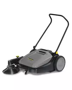 Efficient manual floor sweeper with easy-to-use handle and integrated side brush for precise cleaning
