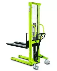 Pramac manual stacker in bright green with black forks, mesh safety guard, pump handle, and swivel castors for light to medium-duty pallet lifting tasks
